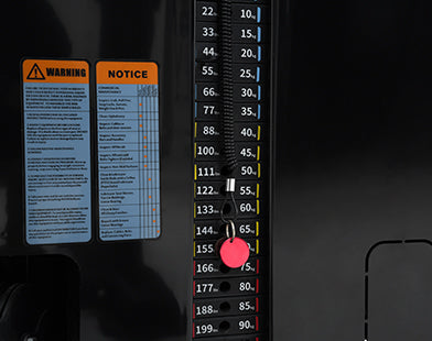 Insight Fitness SA Series Assisted Chin Up - SA008 Measurement scale with warning and notice labels on a dark background
