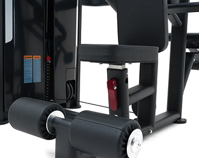 Close-up of a gym machine with black frame and white wheels on a white background