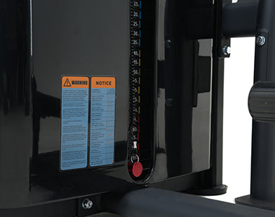 Close-up of a Insight Fitness Abdominal Machine - SA027D with warning labels and control buttons.